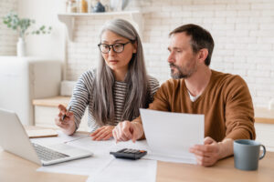 Family members reviewing paperwork to claim unclaimed money from a deceased relative